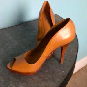Tan open toe Aldo heels.